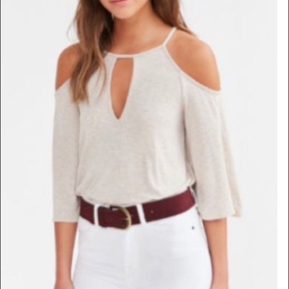 Cream shirt with wide sleeves and shoulder cutout